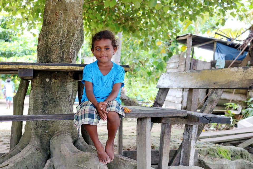 Young girl on Sawinggrai island, Raja Ampat, Indonesia
