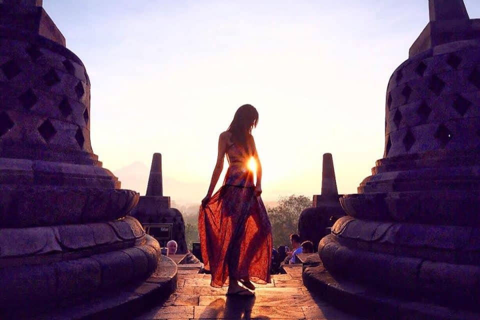 Girl in dress, sunrise at Borobudur, Indonesia
