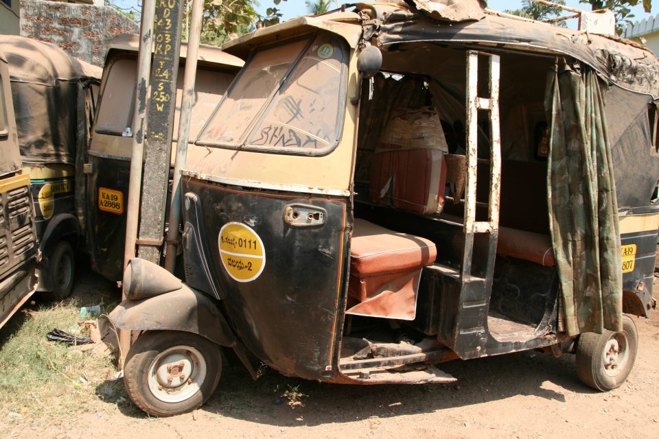A dis-used dusty moto rickshaw