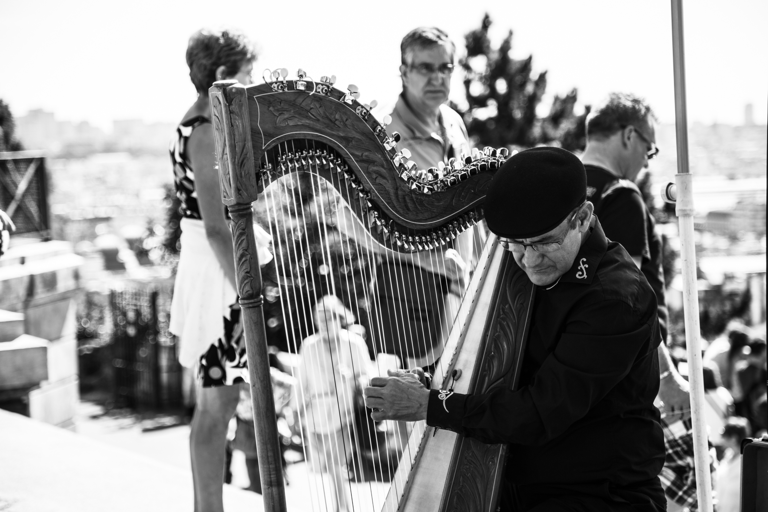 A local man playing a harp