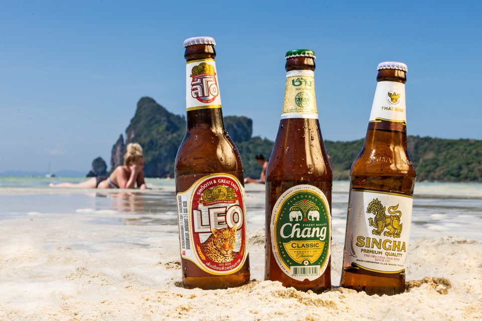 Three bottle of local beer on the beach