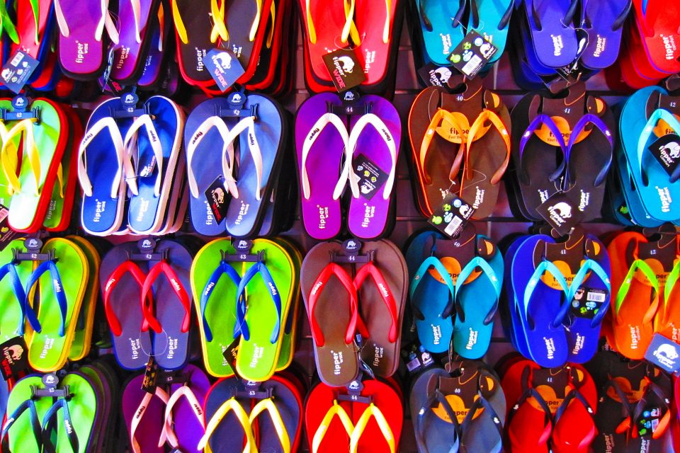 A stall of multi-coloured flip flops