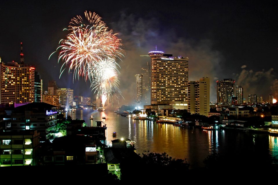 Fireworks over the river and Bangkok skyline