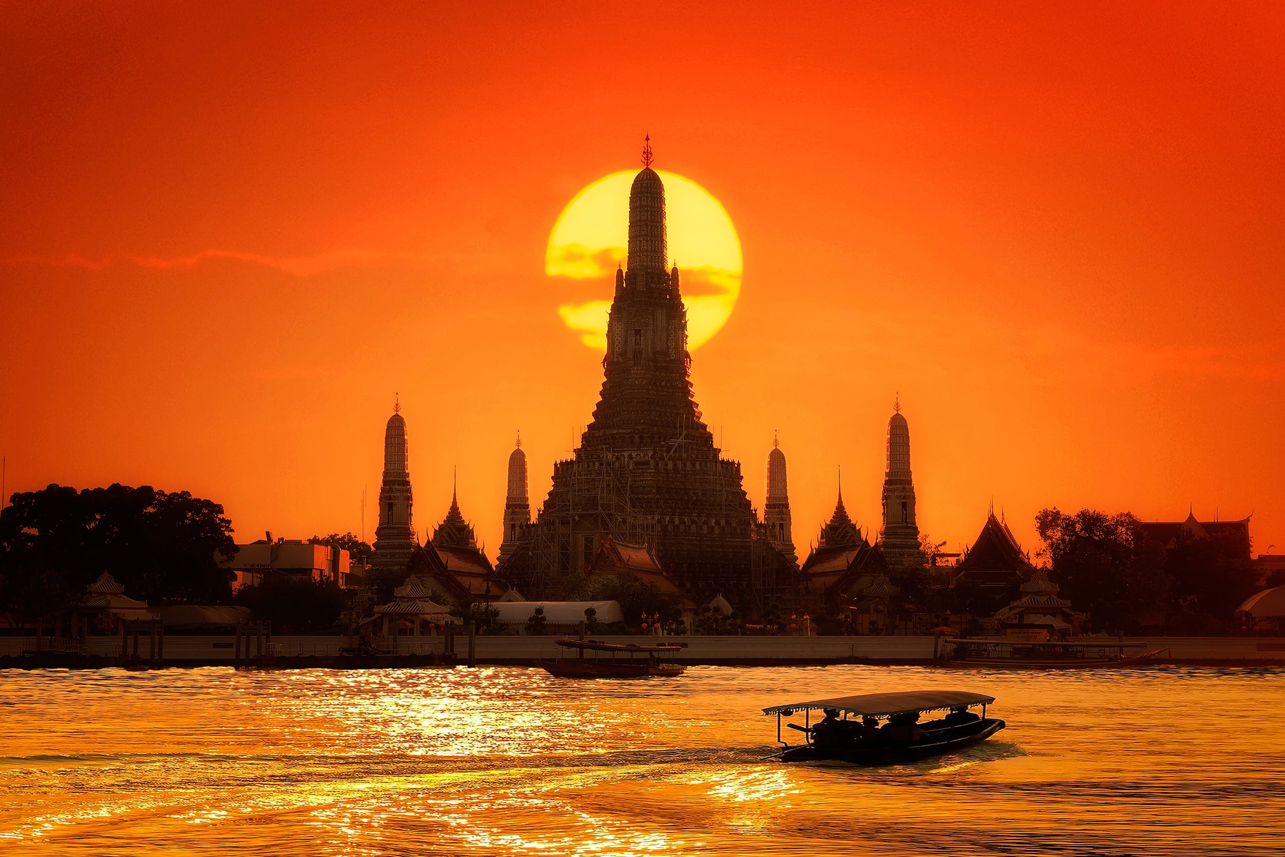 A temple on the water at sunset