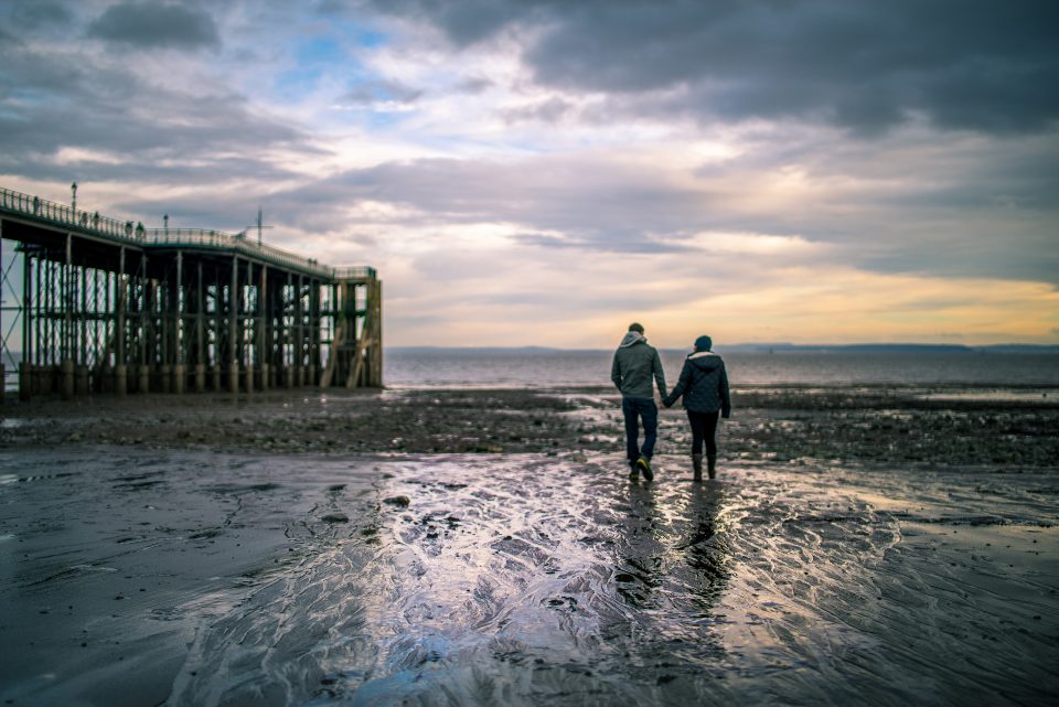 A couple walking on the beach