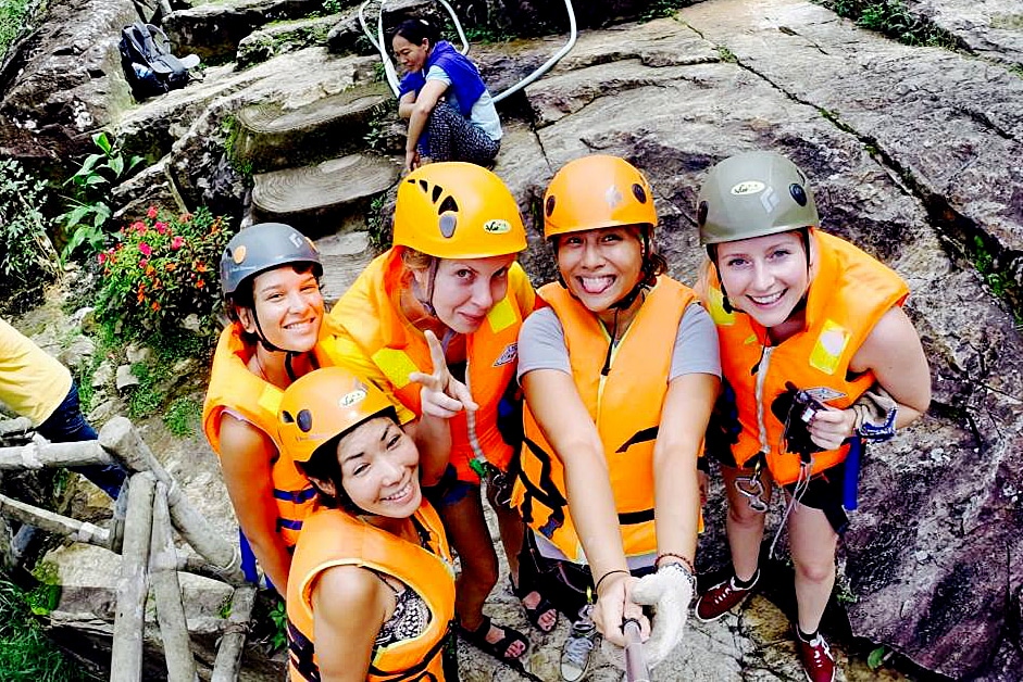 A group of women posing in canyoning gear