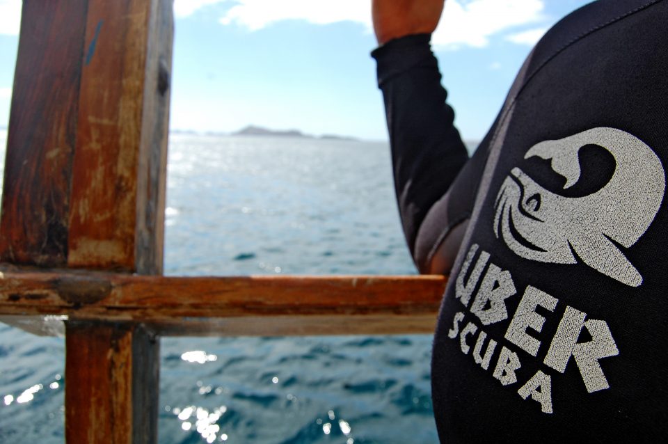 Close up of the uber scuba logo on a wetsuit