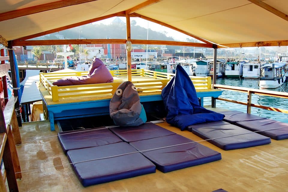 A boat full of mats and beanbags
