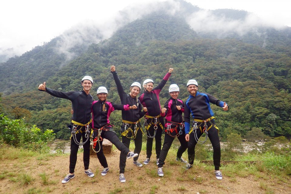 A group of people in canyoning gear
