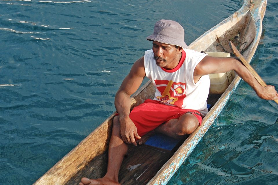 A local man sitting in a canoe