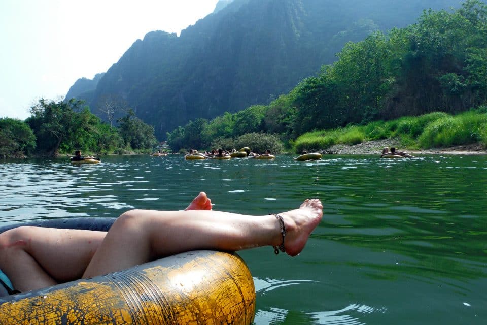 A view of the river and people water tubing