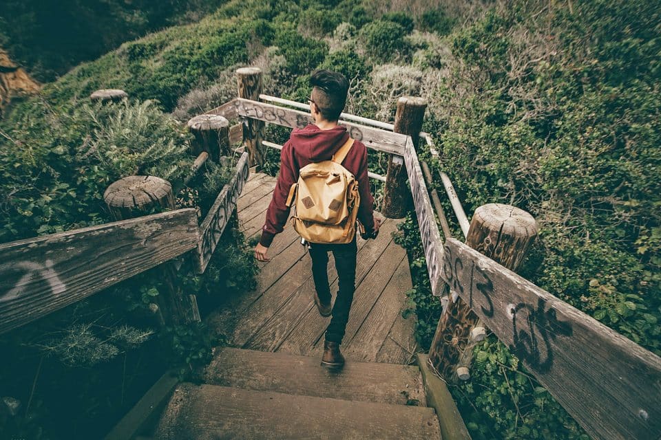 man backpack trekking