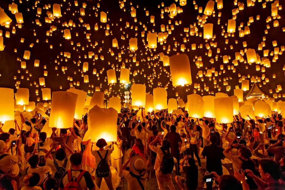 Multiple lanterns being let go into the sky