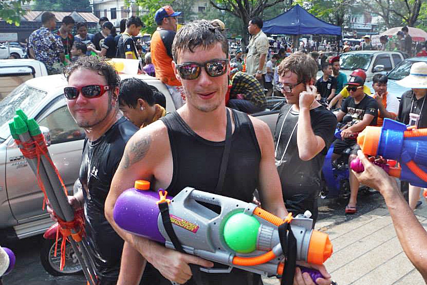 A group of people with water guns