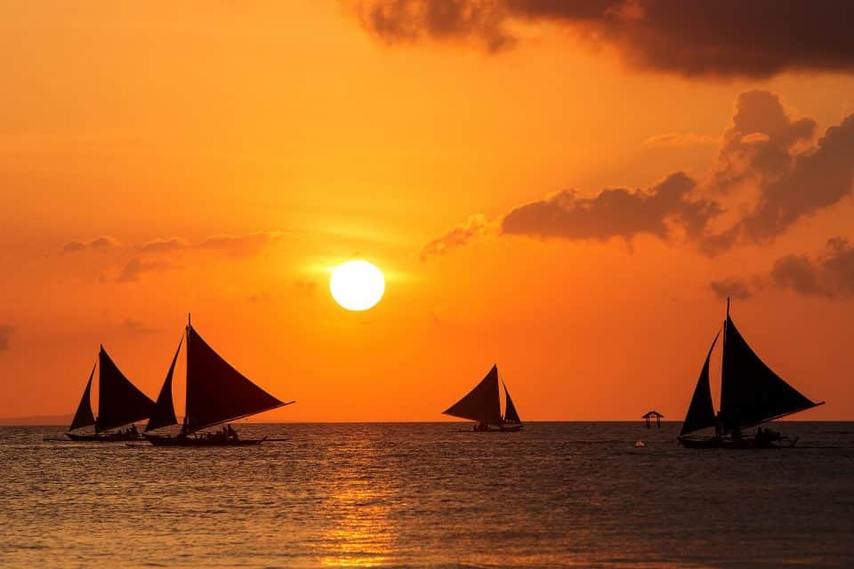 Sailboats on the sea at sunset