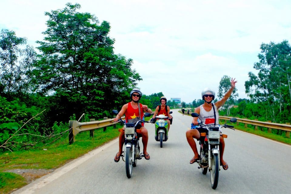 A group of men riding motorbikes towards the camera