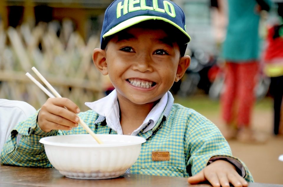 Vietnam kid eating noodles