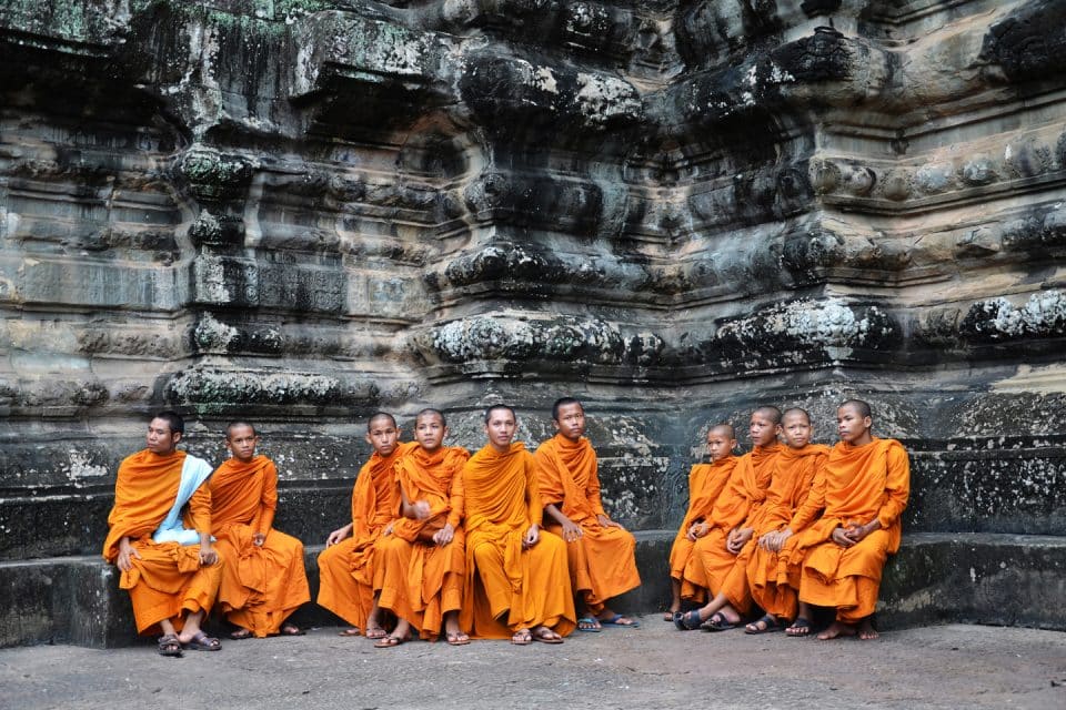 A group of monks sitting down