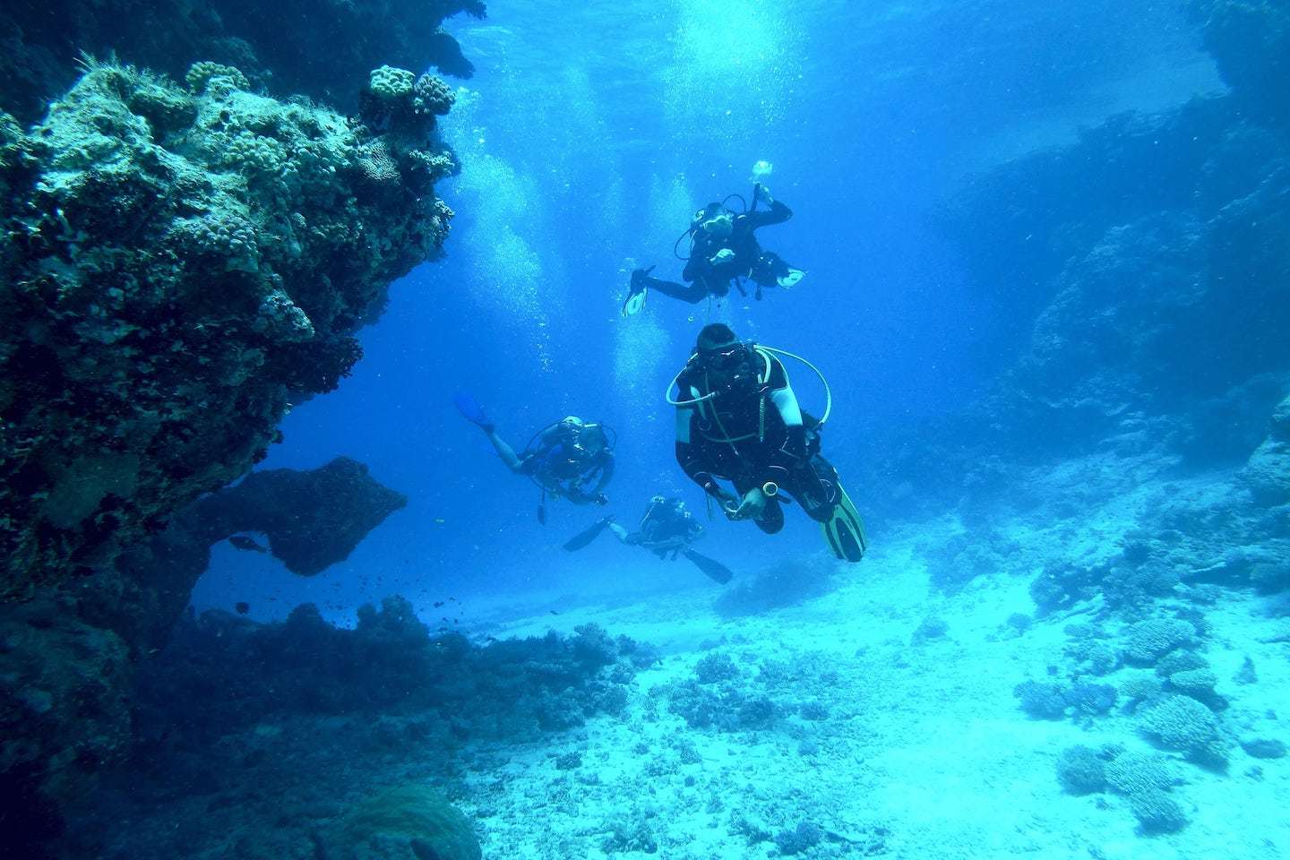 Scuba divers in deep water