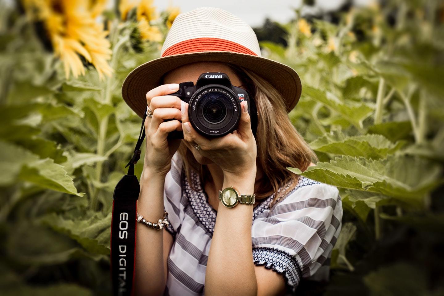 female holding camera