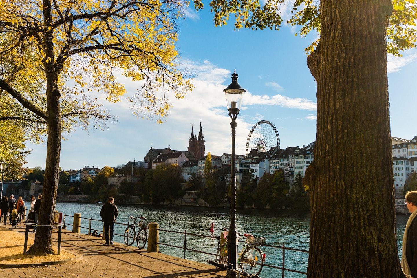 promenade with ferris wheel and towers in basel switzerland