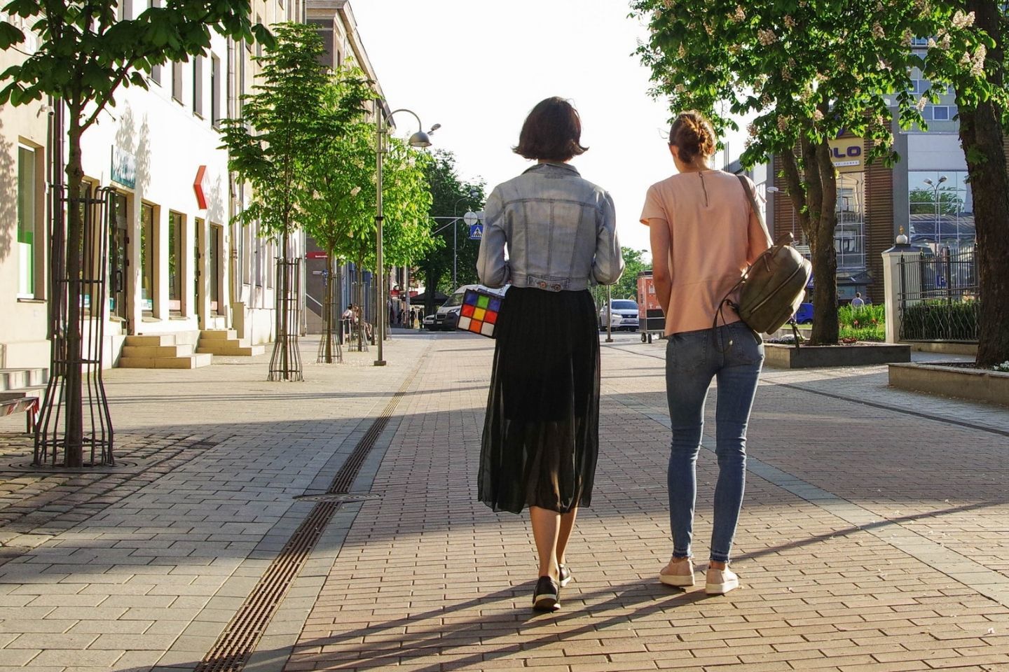 ladies walking in a city
