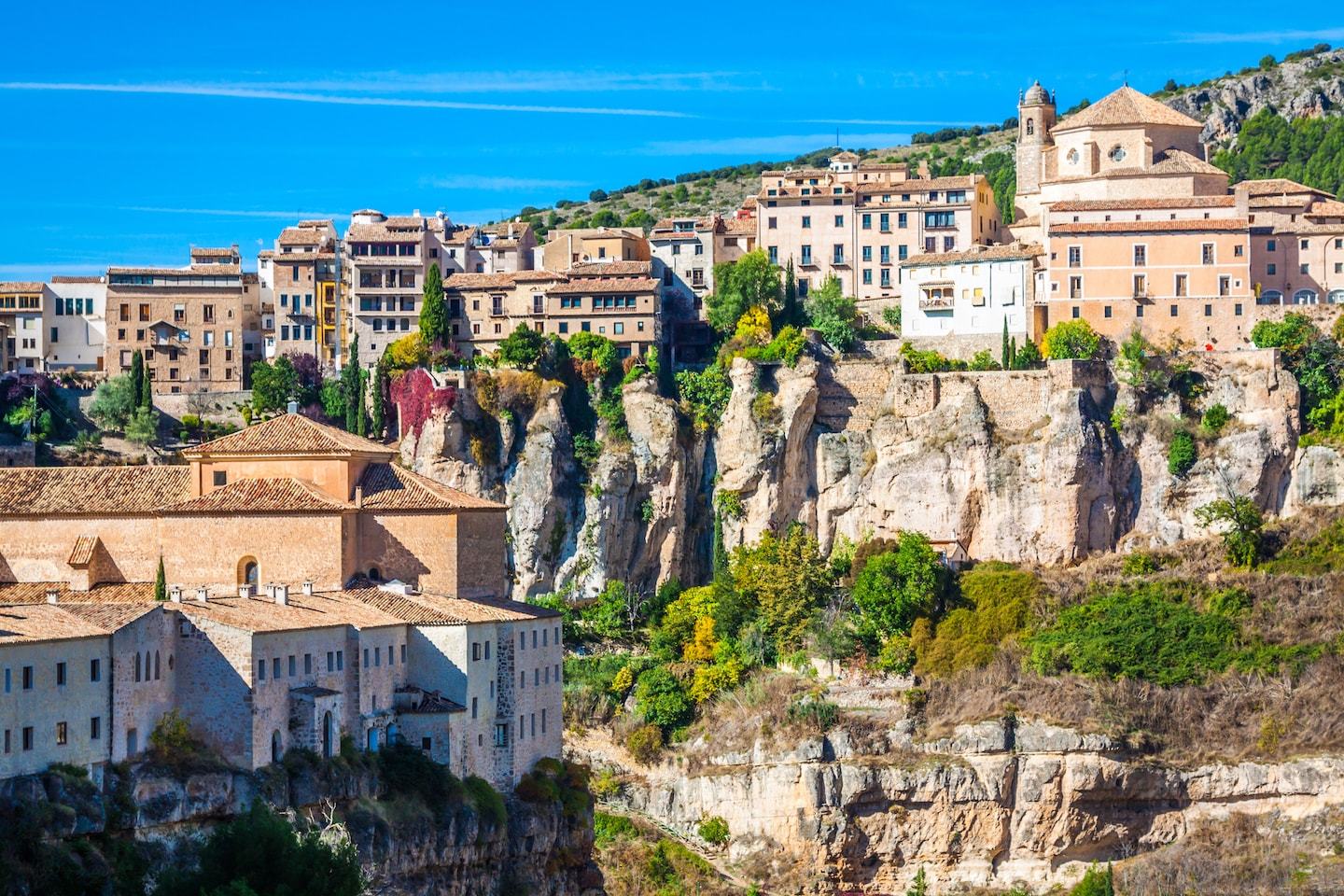 hanging houses on the side of a cliff in cuenca spain