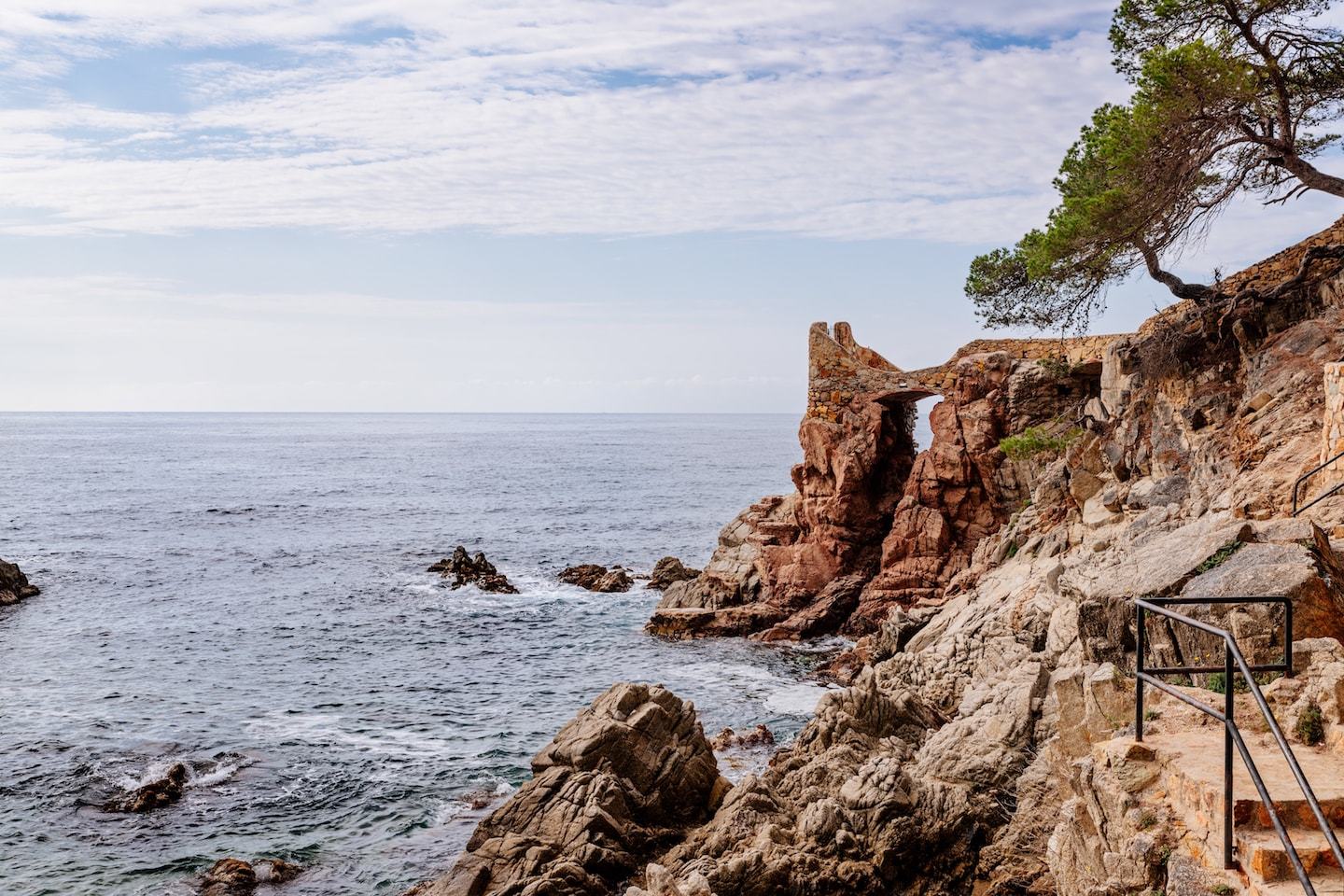 rocky hiking path along the sea in costa brava spain
