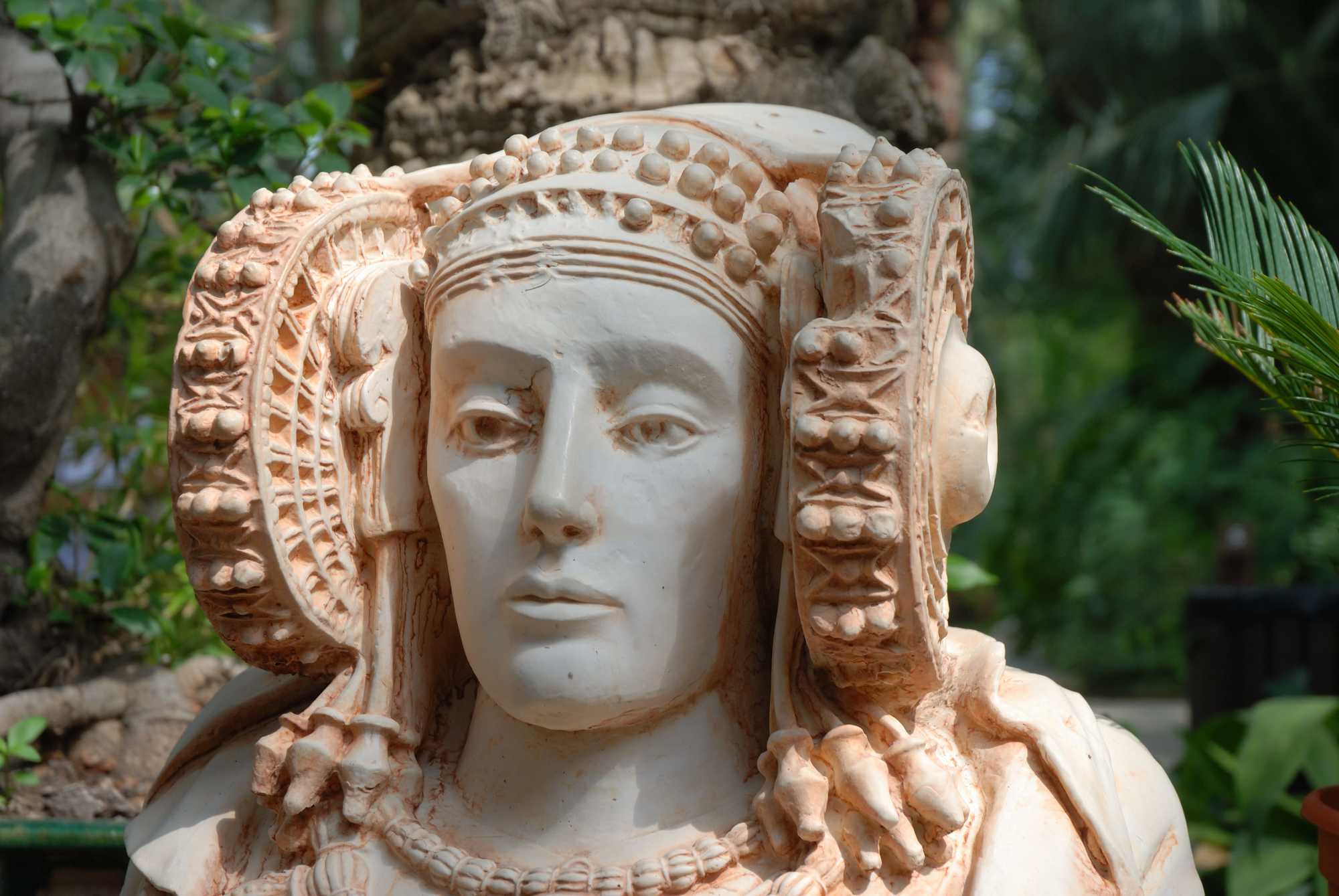 very detailed bust of a lady in white stone