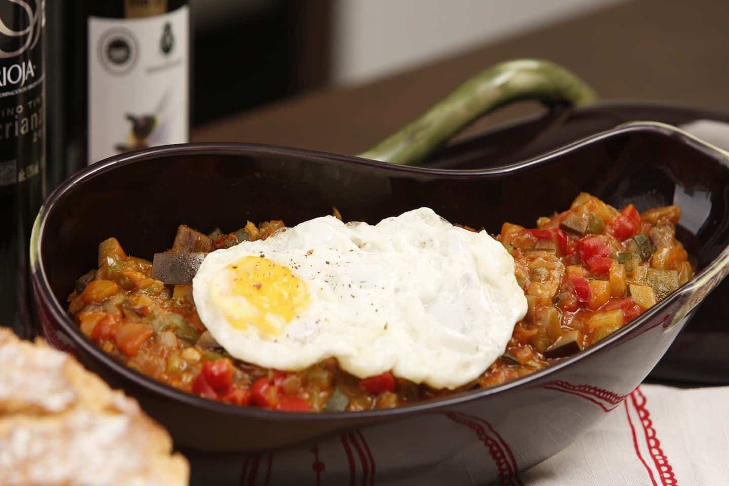 cooked vegetables with fried egg on top