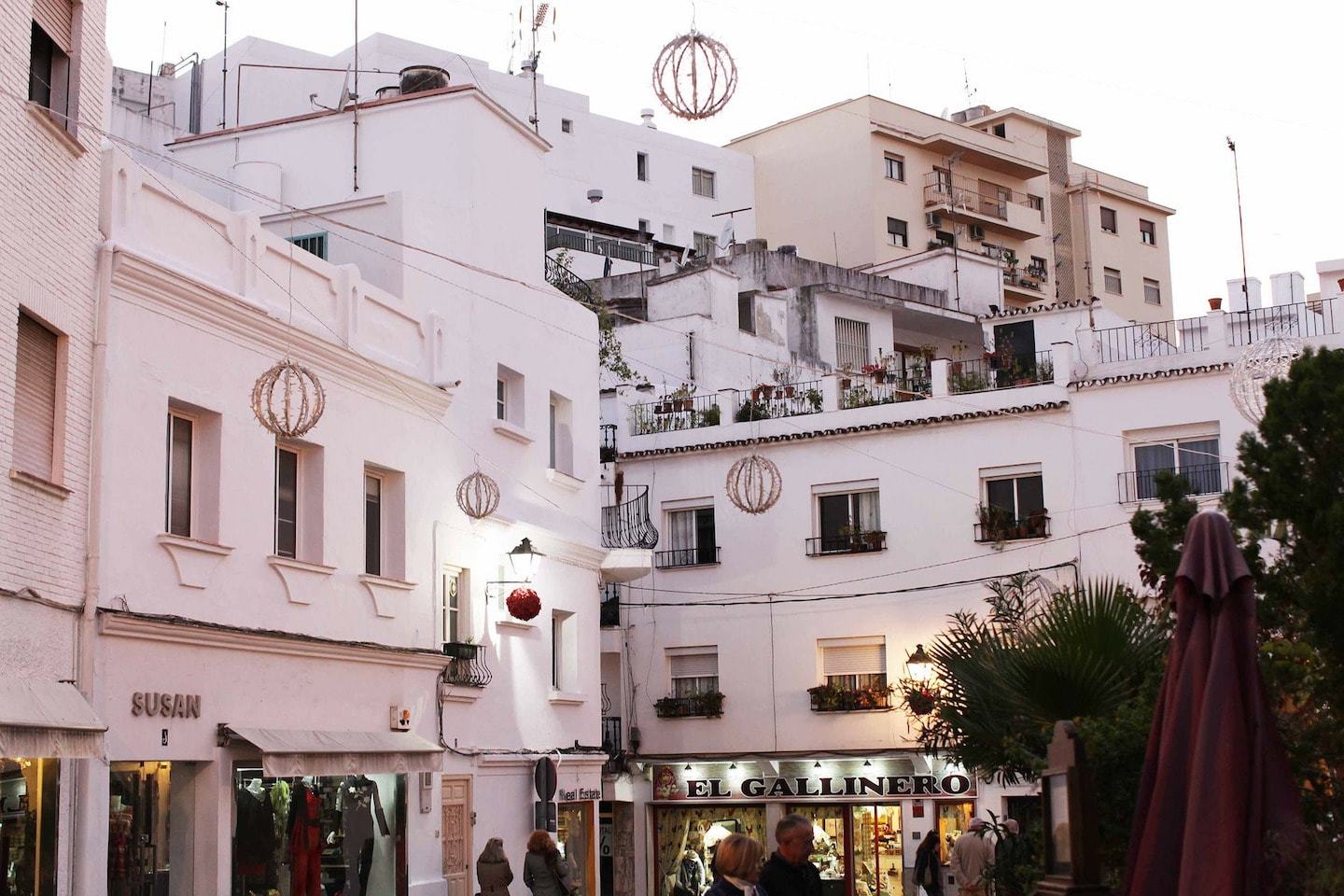 white houses and shops in marbella spain