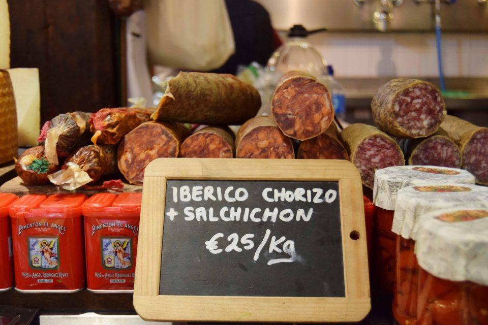 different types of spanish sausage being offered for 25 euros per kg