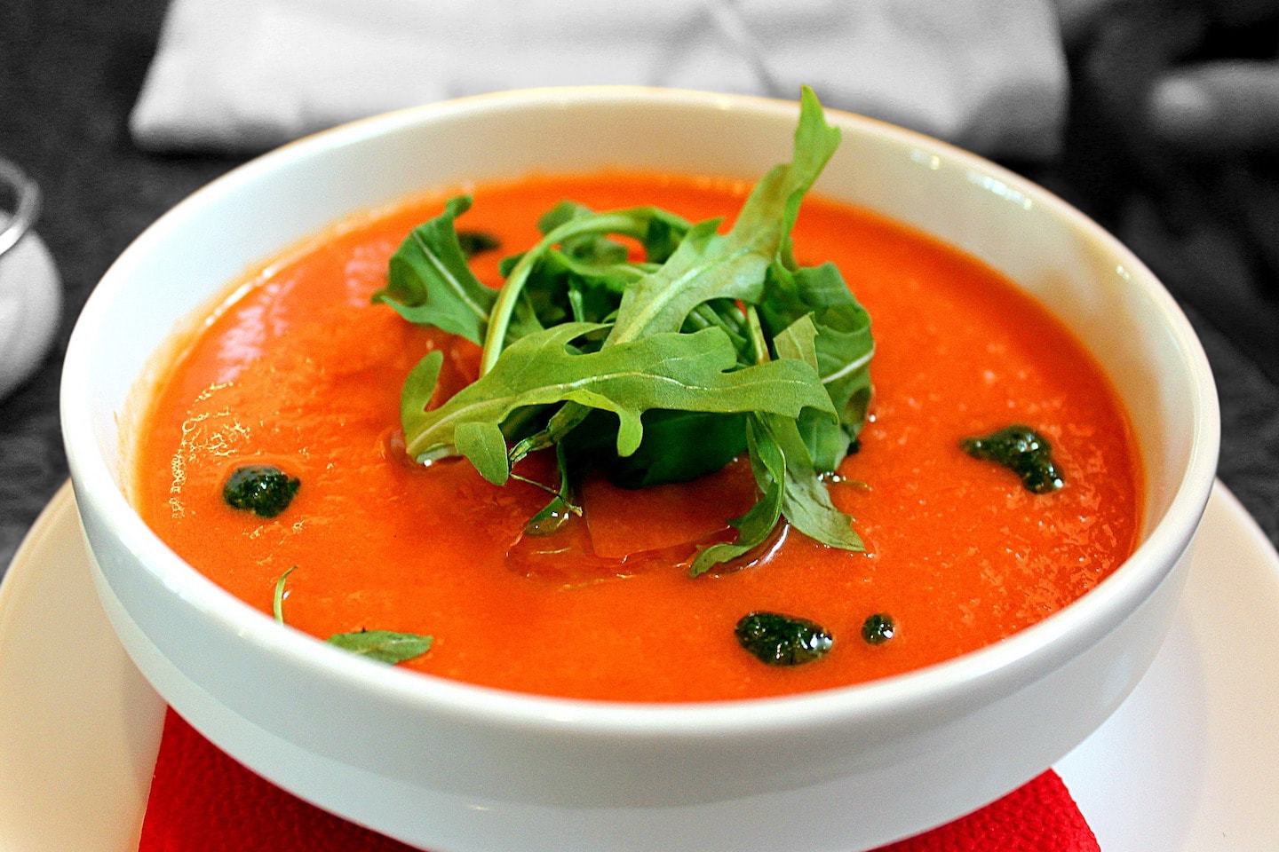 tomato soup with arugula garnish