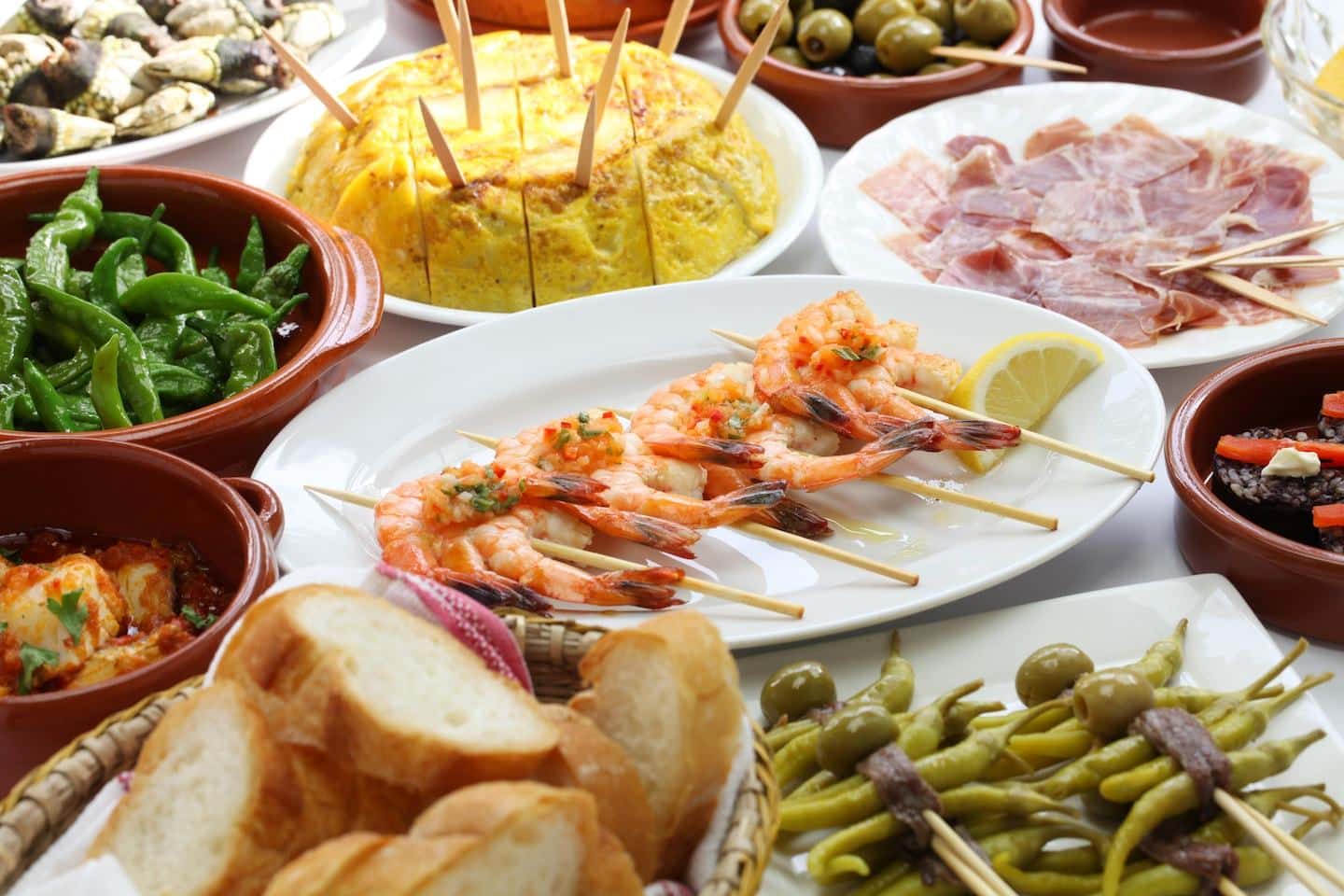 spread of different tapas dishes in spain