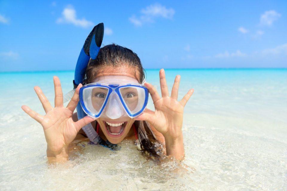 girl smiling, wearing a dive mask