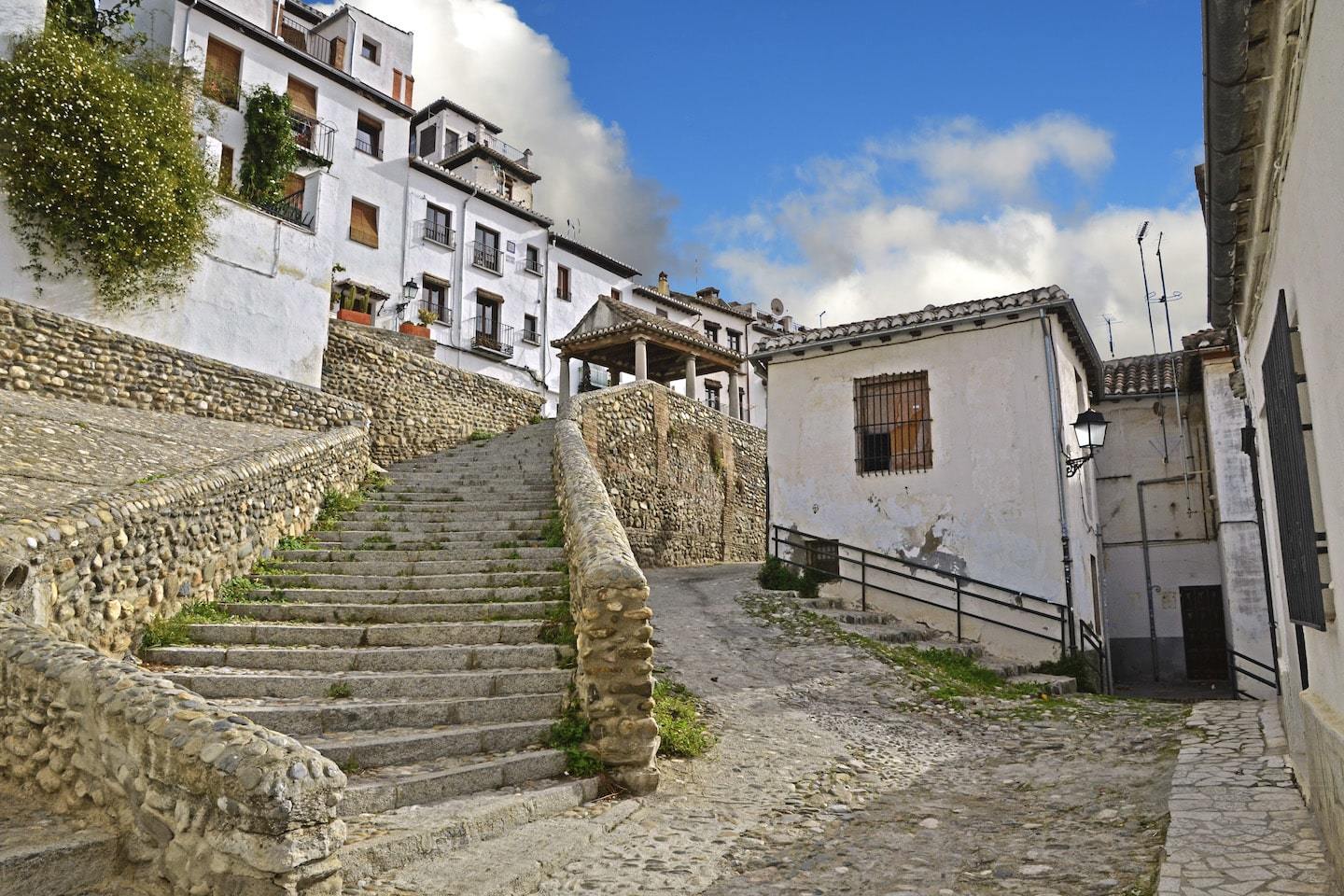 stone steps and buildings in front of blue sky