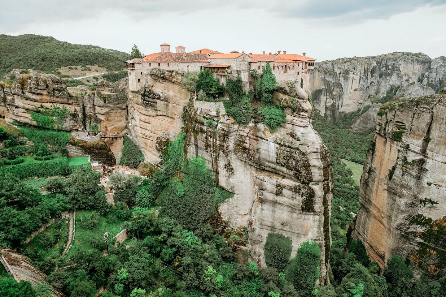 Best places to visit in Greece: Monastery sitting on top of a giant cliff in Meteora, Greece