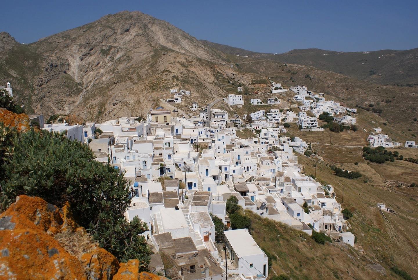 white washed village surrounded by mountains in anafi Greece