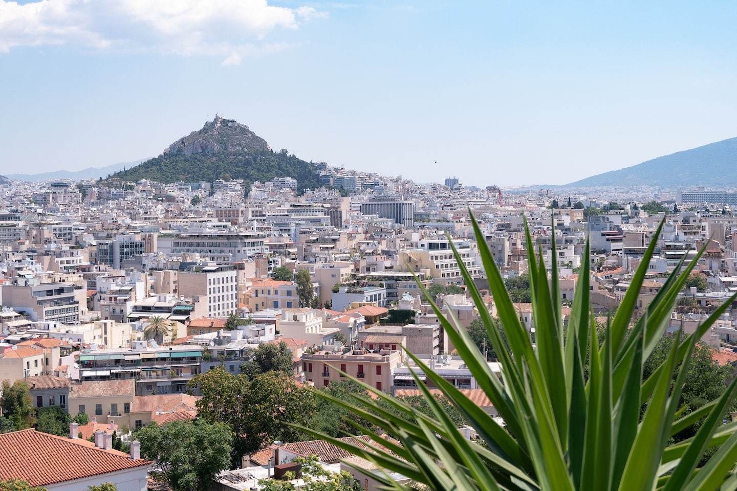 View of Athens, Greece with a giant mountain behind