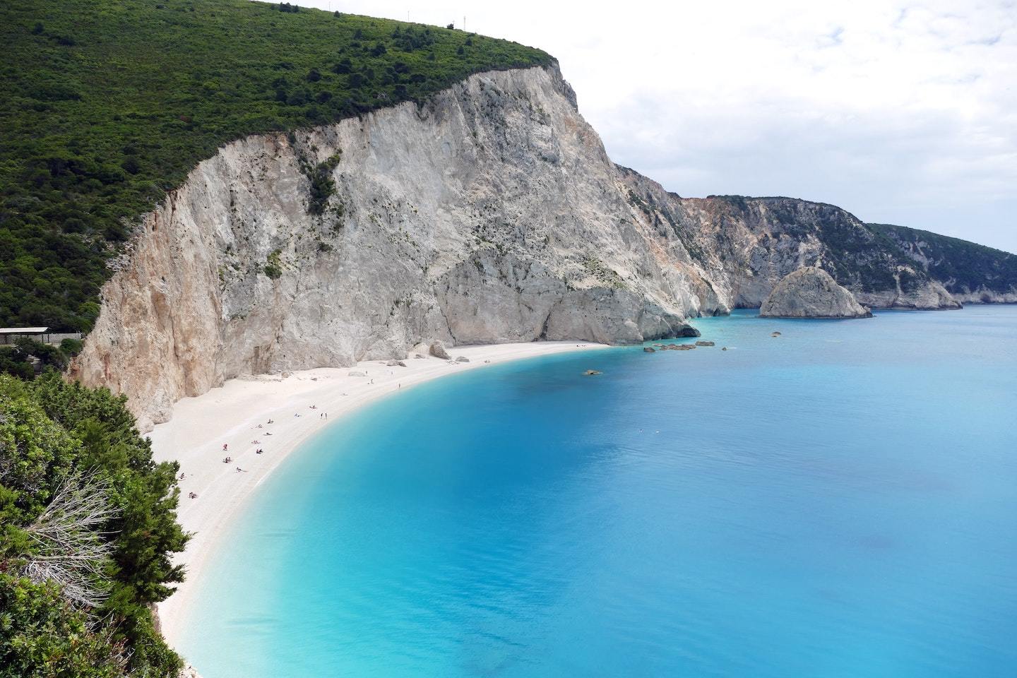 beach surrounded by giant cliff in Lefkada Greece