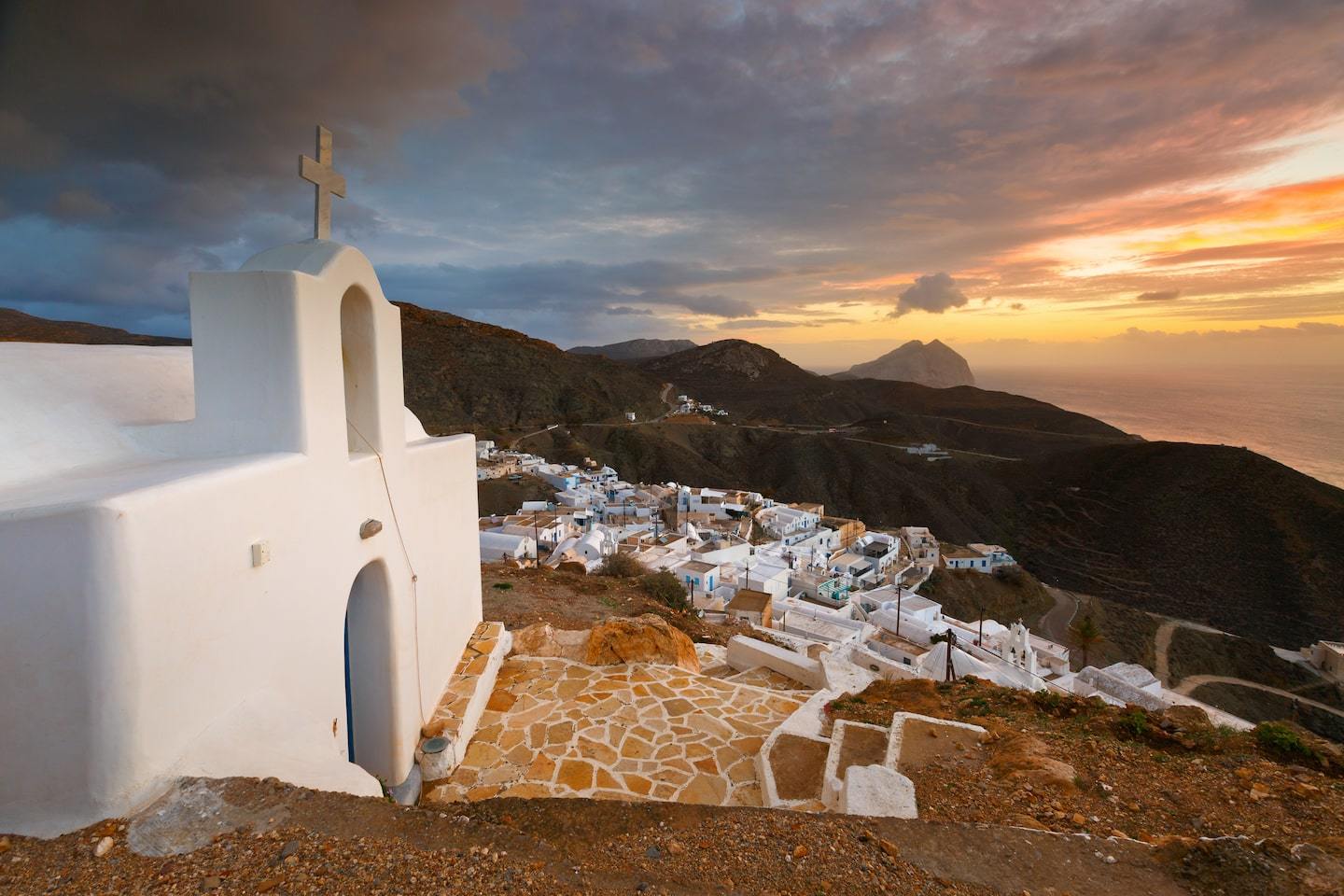 Cyclades: church on a hill with sunset behind in serifos, Greece
