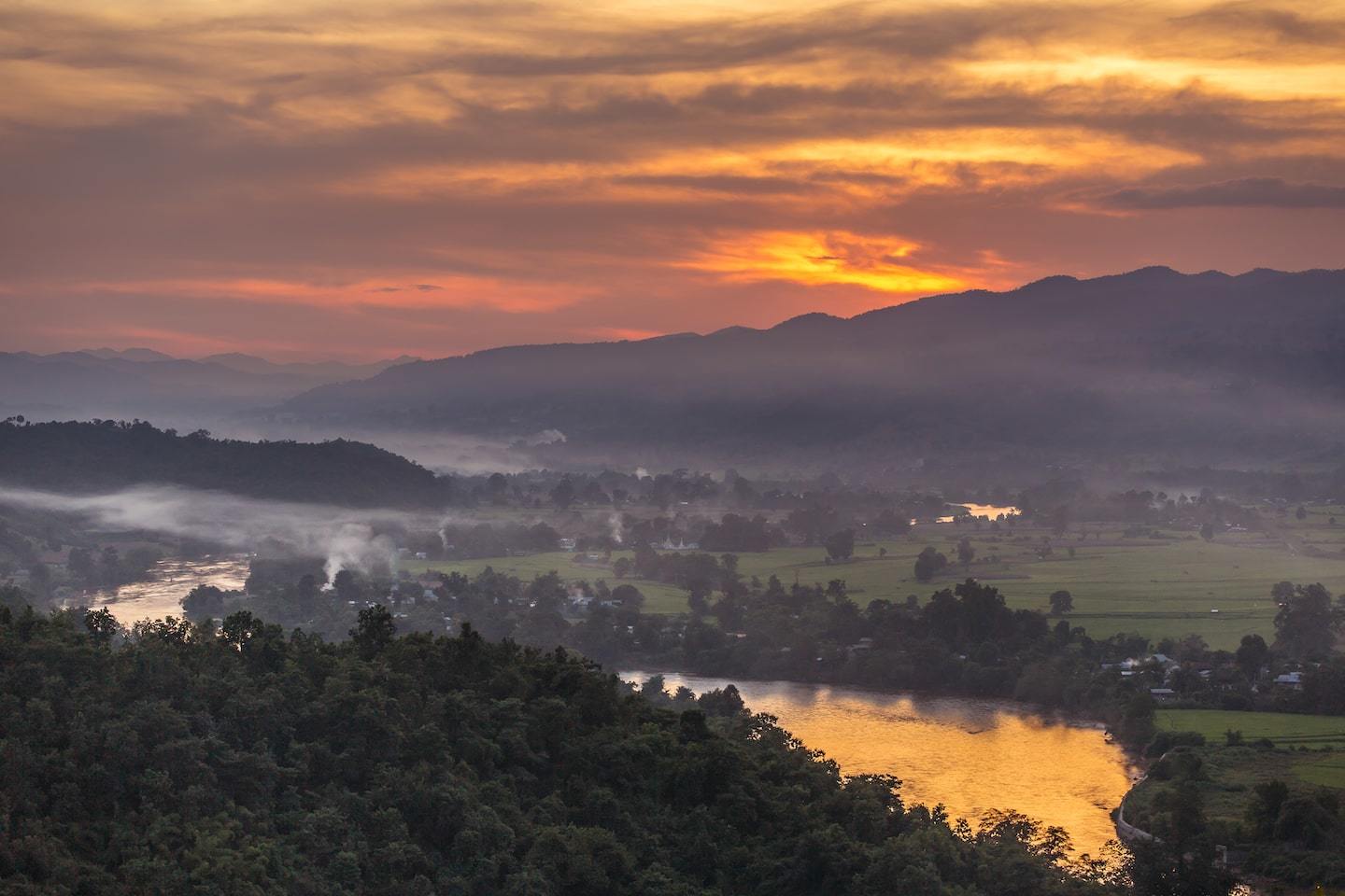 Sunset over Hsipaw myanmar with river and mountains in background
