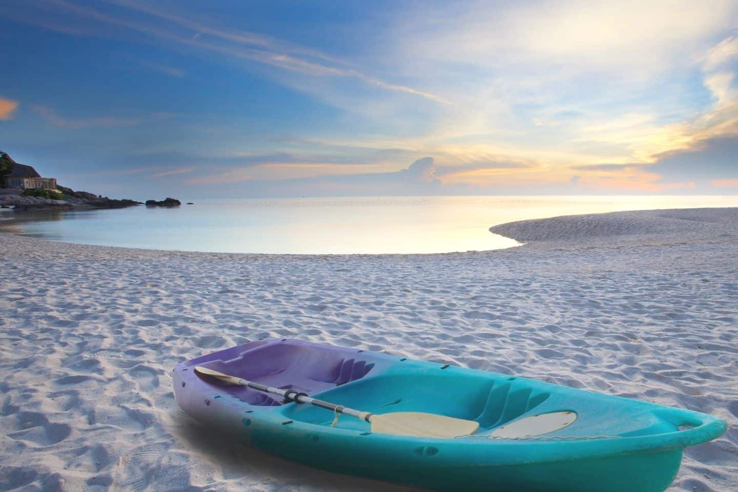 Blue kayak on the beach