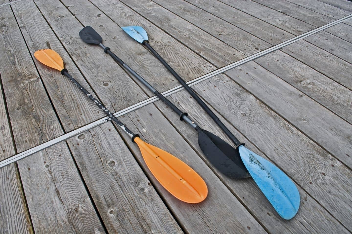 Three kayak paddles
