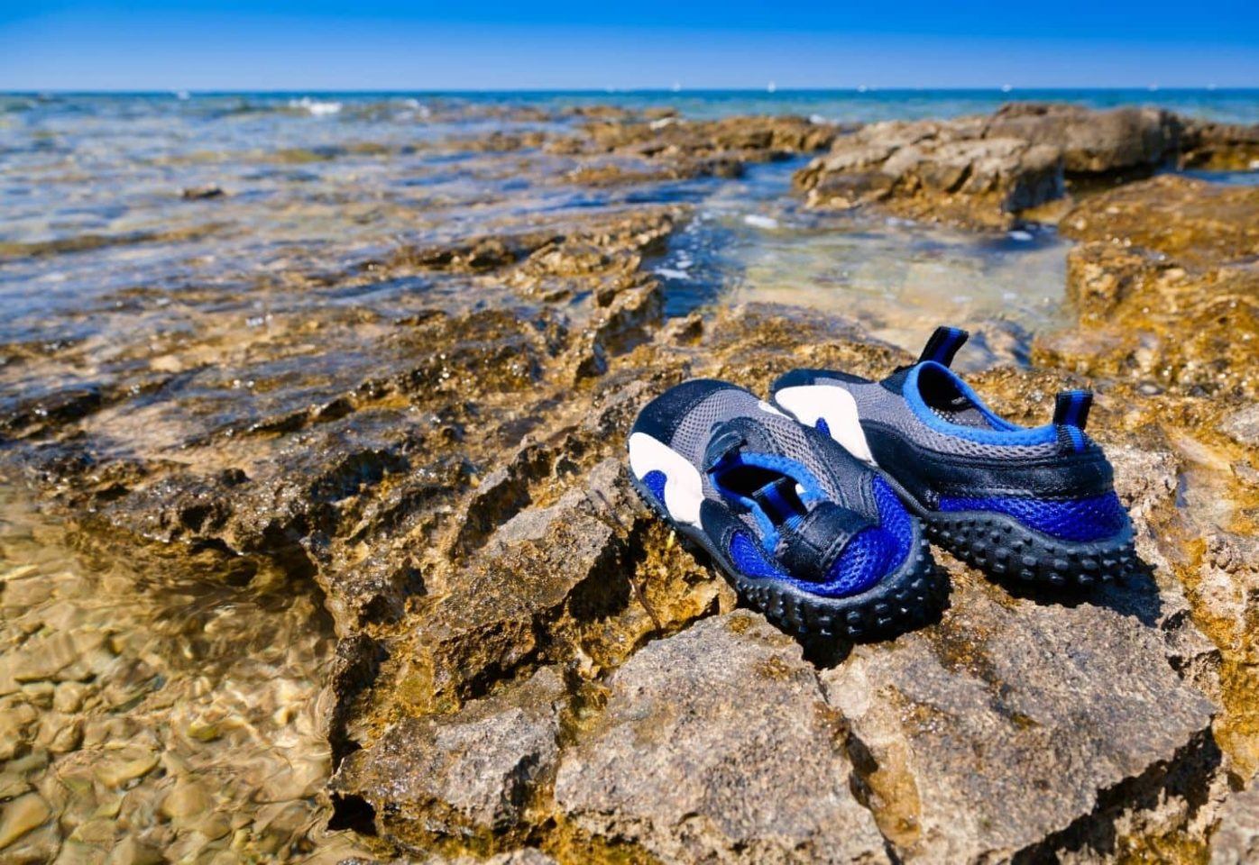 Kayak shoes on sea rock