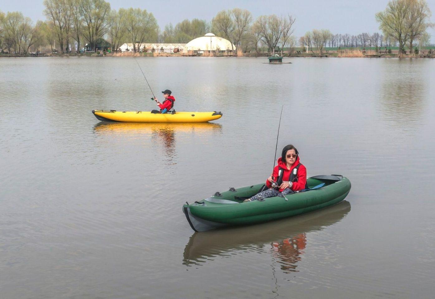 two fisherwoman on inflatable kayak