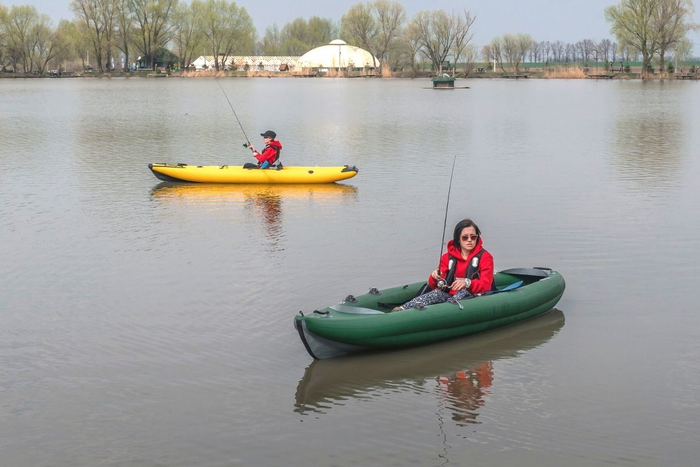 two fisherwoman on inflatable kayak