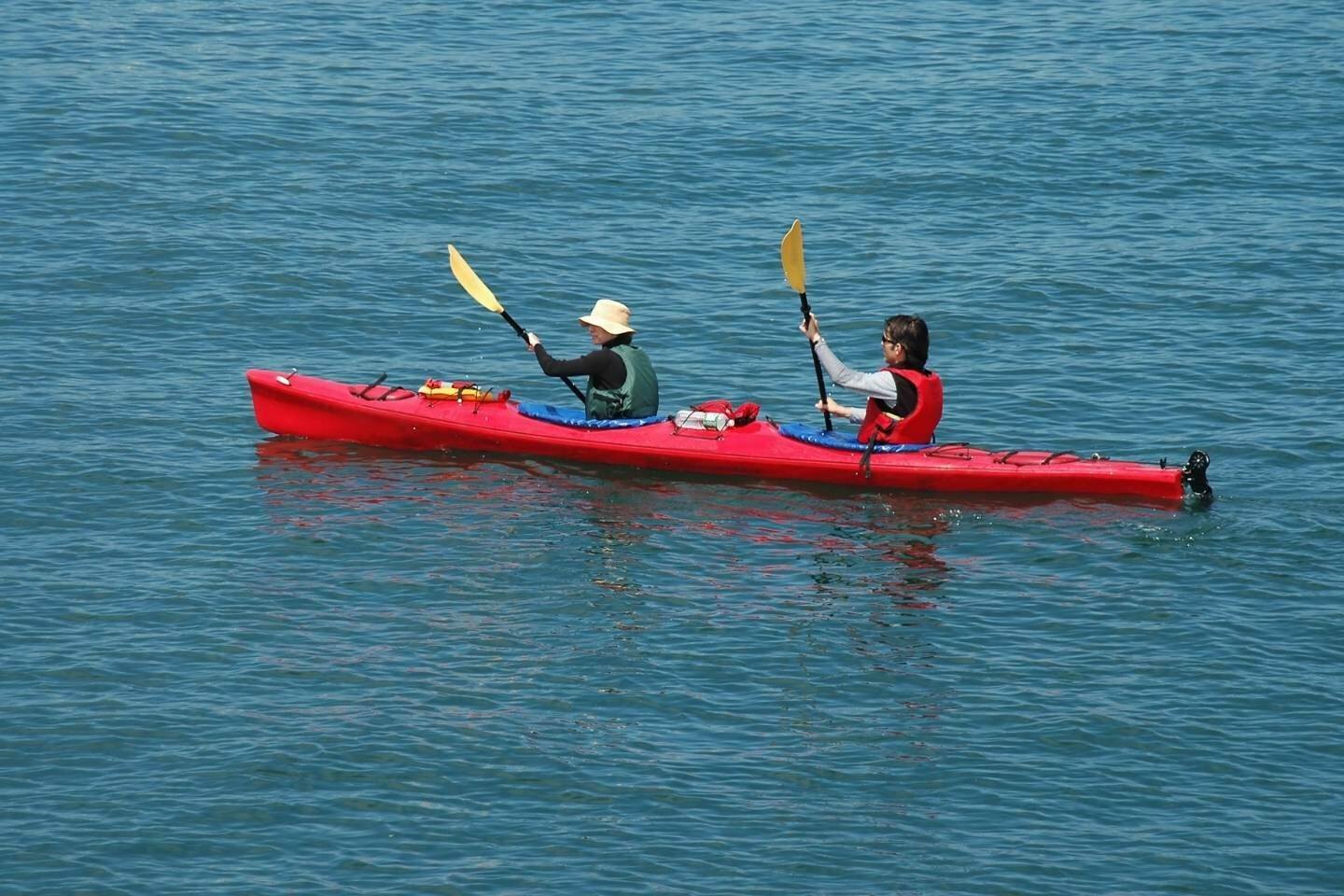 Kayakers on red kayak