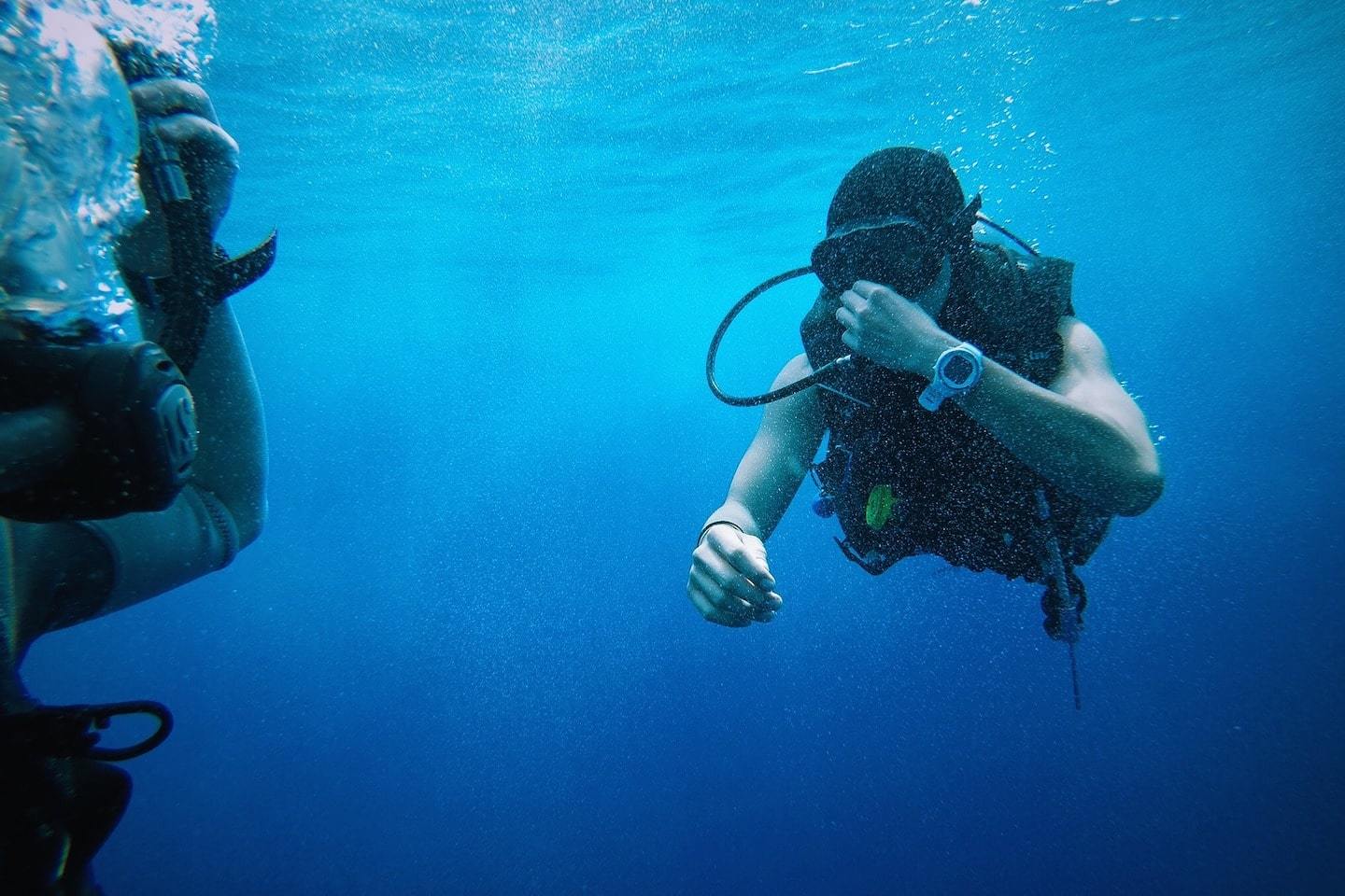 scuba diver wearing a watch or dive computer