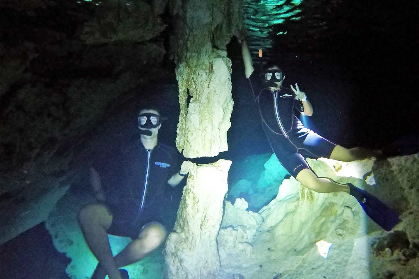 founders of this blog snorkeling around the Tulum cenotes